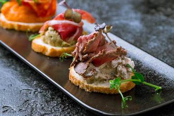Bruschetta with roast beef macro close up selective focus