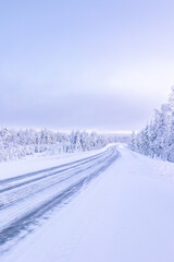Fototapeta na wymiar Winter road covered in ice and snow