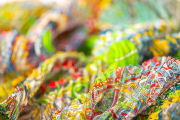 Fototapeta na wymiar Multicolored corrugated fabric as a background. Lightweight material for scarves and summer wear.