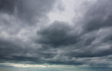 Fototapeta na wymiar Background of gloomy sky and dark black clouds. surface texture stormy sky