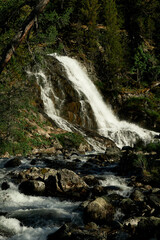 Waterfall of Lake Poperechnoe on the Multa River in the Katunsky Reserve of Altai