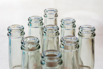 Close up empty soft drinks glass bottles. Recycled glass concept.