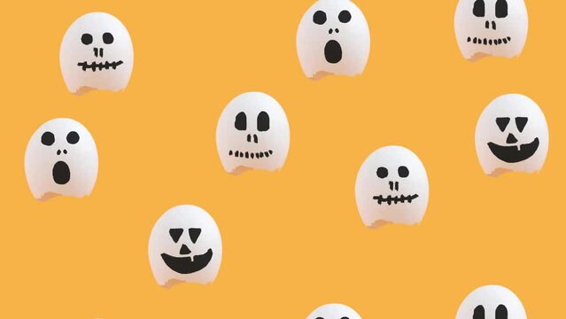 Funny creative Halloween concept with flying eggshells painted as ghost characters 4k.
