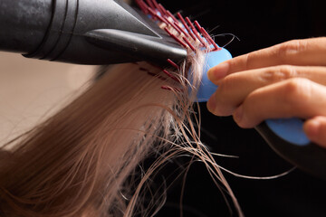 Airtouch Hair stylist makes bouffant using comb on thin strands. Shatush technique for hair...