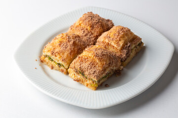Traditional turkish new dessert cold milky baklava with pistachio (Turkish name; soguk baklava)
