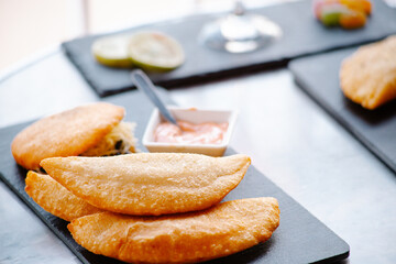 fried empanadas with salsa, traditional Venezuelan food