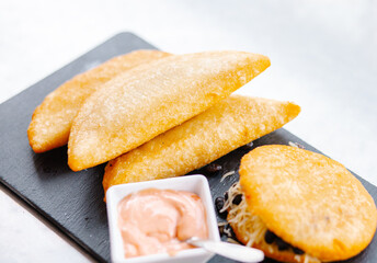 fried empanadas with salsa, traditional Venezuelan food