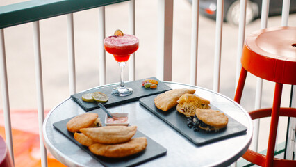 traditional Venezuelan food with cocktails