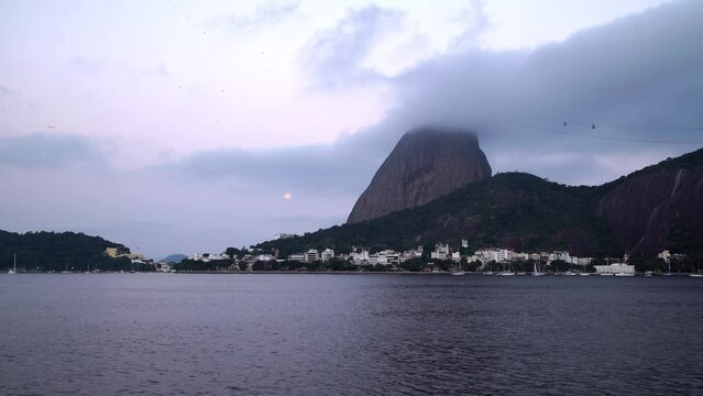 Time Lapse Lockdown Shot Of Cable Cars Moving Towards Natural Mountain By Guanabara Bay - Rio de Janeiro, Brazil