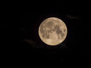 Fototapeta na wymiar Close-up photo of the full moon against a dark sky