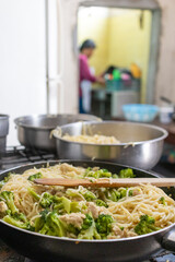 chicken and broccoli pasta in a skillet