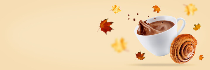 Orange autumn background with hot chocolate or coffee and sweets, like cake; cookies and donut