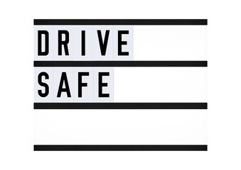 Drive Safe message sign on a retro quote board with black letters and white background. Transportation message