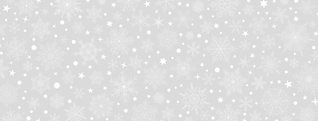 Background of complex big and small Christmas snowflakes in gray colors. Winter illustration with falling snow