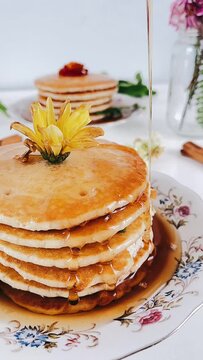 pouring maple syrup on top of stack of pancakes, stack of pancakes, Pouring Syrup on pancakes, Maple Syrup, Breakfast pancakes, Stack of pancakes for breakfast, syrup