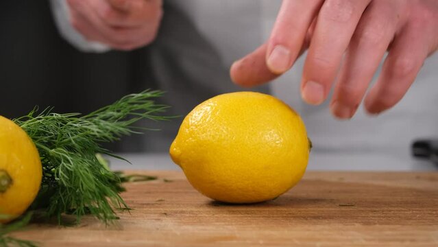 chef cutting lemon