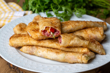 Turkish Pacanga Boregi with pastirma (pastrami) and cheddar (melted) cheese. - Pastirmali Borek