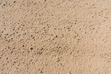 Road underfoot, sand and gravel, top view