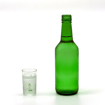 소주병과 소주잔-A bottle of soju and a glass filled with alcohol	