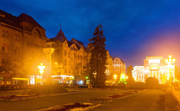 Illuminated Victoriei Square with National Opera house at dusk, Timisoara, Romania