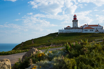 Fototapeta na wymiar Scenic view of lighthouse at cape Cabo da Roca in sunny spring day, Portugal