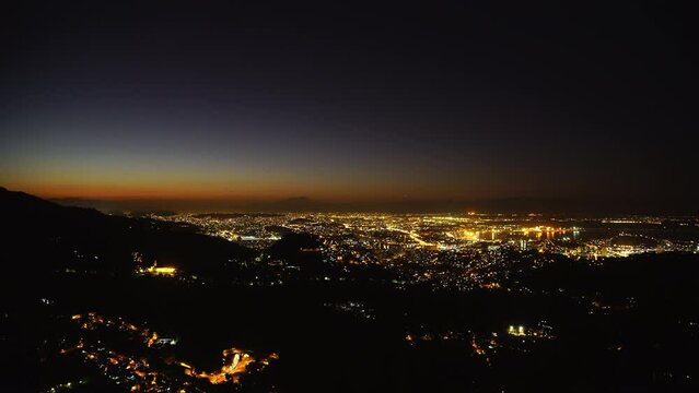 Aerial Time Lapse Lockdown Shot Of Sparkling Residential City By Sea At Night - Rio de Janeiro, Brazil