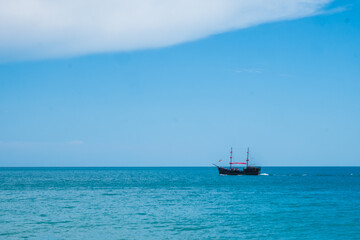 Obraz premium Two mast schooner under sails on the sea. Cross processed. High quality photo