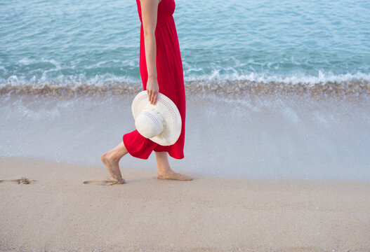red dress on beach Relaxed Beach Wedding in Cabo with the Bride in Red Rock n Roll Bride