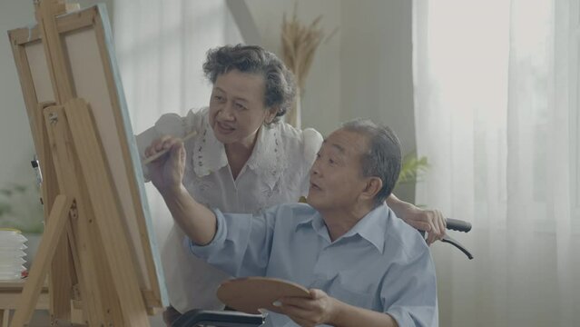 Artist concept of 4k Resolution. Asian families drawing together in the living room. Artist is creating work. Leisure activities and hobbies.