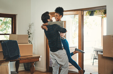 Homeowner couple celebrating, hugging and cheering in new home as real estate investors, buyers and...