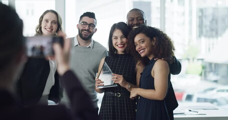 Business people taking photo at an awards ceremony, celebrating success and receiving a trophy for good work at a conference. Colleagues taking a picture after an achievement, win or company event