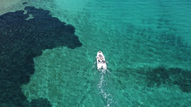 A boat passing through the sea in Croatia filmed from above