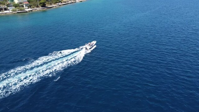 An amazing view from above of a boat passing by the coast of Croatia in Zara