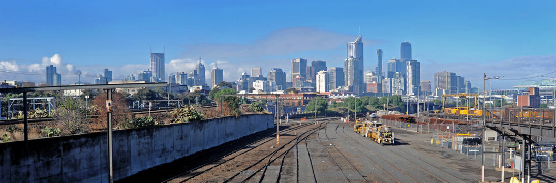  Jolimont sidings Melbourne with track grinder sitting idle and city backdrop on a beautiful day.