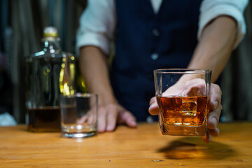 Bartender Serve Whiskey, on wood bar, 