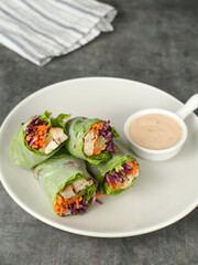Vegetable spring roll, fresh roll salad made from mix vegetables and roasted chicken. 