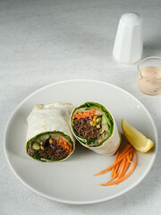 Salad Wrap. Tortilla wraps with beef teriyaki and fresh vegetables. 