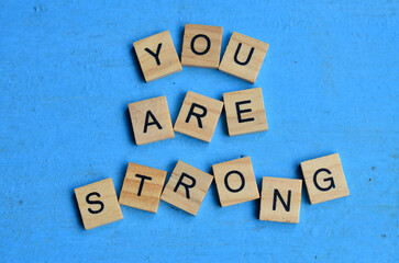 you are strong text on wooden square, health motivation quotes