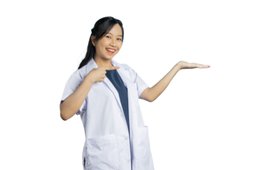 Portrait of young Asian beautiful nurse in white uniform with big smiled show hand to present your product or text on copy space blue background.