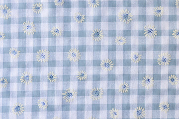 Plaid fabric with floral print textured background