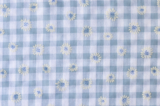 Plaid fabric with floral print textured background