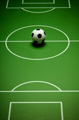 miniature soccer ball on the table soccer board