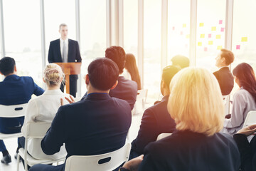 Senior business man talking at podium speaker. Business people meeting at business conference room