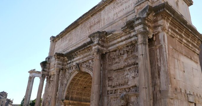 Arch of Septimius Severus, detail of carvings and reliefs, tilt down close-up top to bottom view of the Arch of Septimius Severus in the Roman Forum in Rome, Italy.