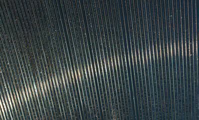 Abstract background. Striped carbonate with drops of morning dew on a sunny summer morning. transparent roof. Bottom view.
