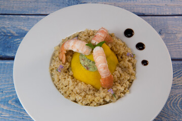 Recipe for Boulghoursotto and mini patisson stuffed with mozarella and basil and its scampi. High quality photo
