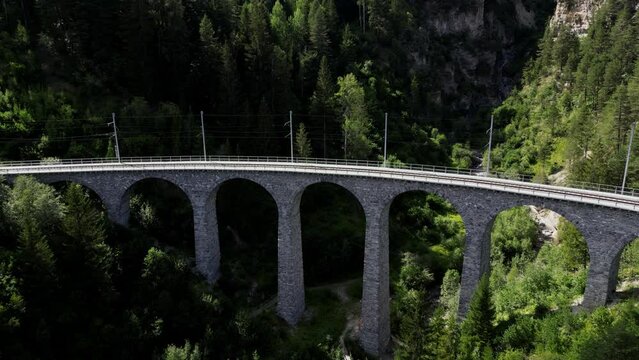 A viaduct in the canton of Grisons in Switzerland. Over this construction leads the track with the train. This is the route of the Glacier and Bernina Express