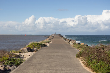 Fototapeta na wymiar breakwater pier at the beach sea
