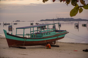 Fisherman cleaning the boat in Belitung Island 