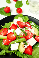 Concept of tasty salad, salad with strawberry, close up